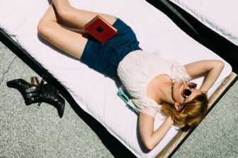 A girl soaking up the sun with shades