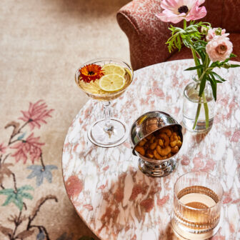 Goldies Table setting with mixed nuts and cocktails