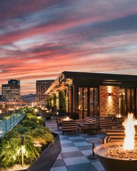 Charmaine's Rooftop Bar & Lounge night view with sunset and city skyline